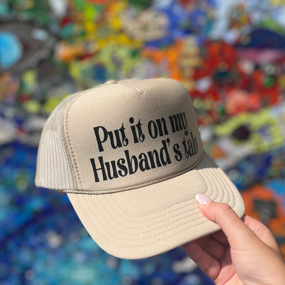 Put It On My Husband’s Tab Trucker Hat